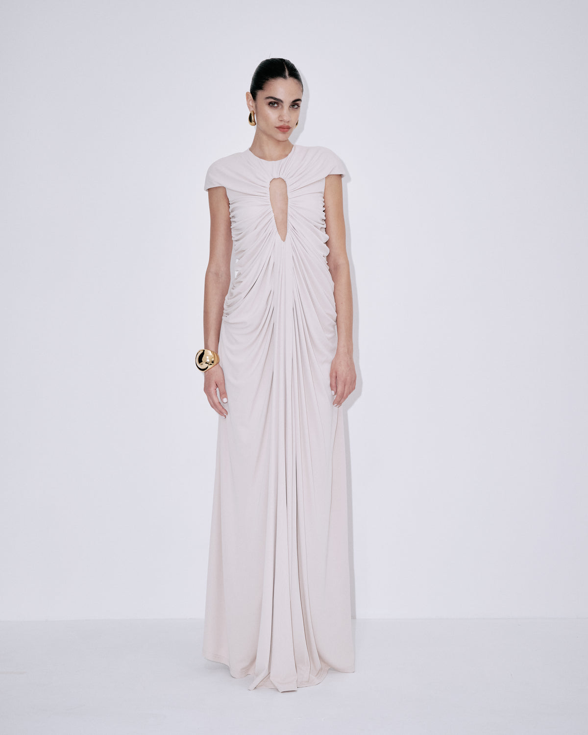 Cream ruched maxi dress with short sleeves and keyhole neckline, side drape