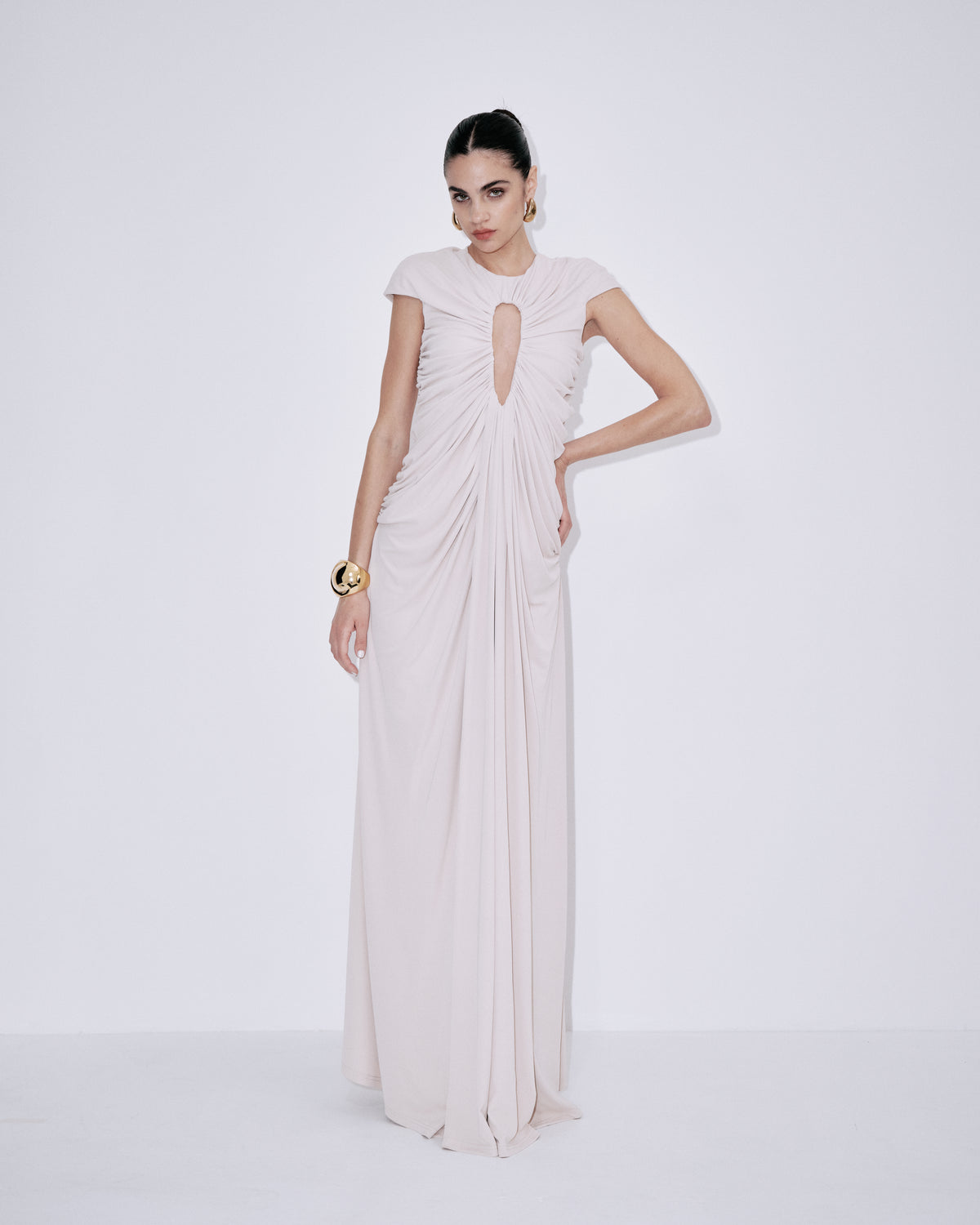 Cream ruched maxi dress with short sleeves and draped front, side view