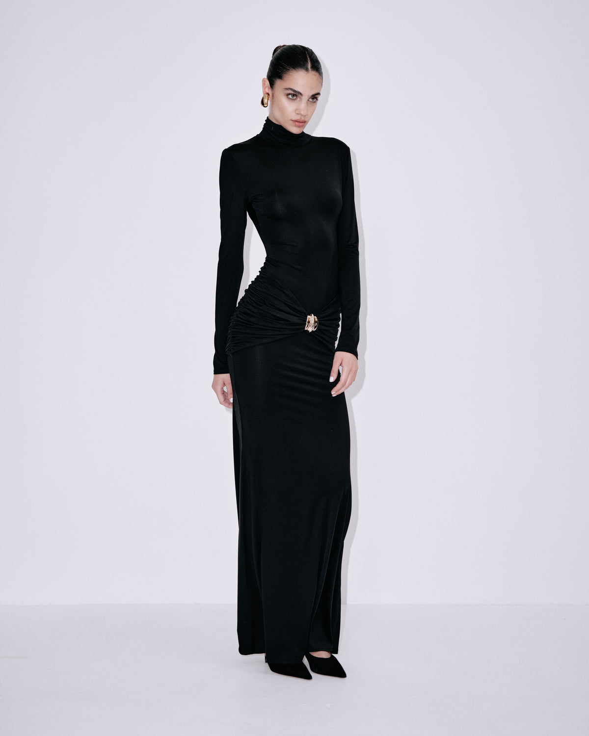 Black fitted turtleneck maxi dress with long sleeves and ruched waist detail