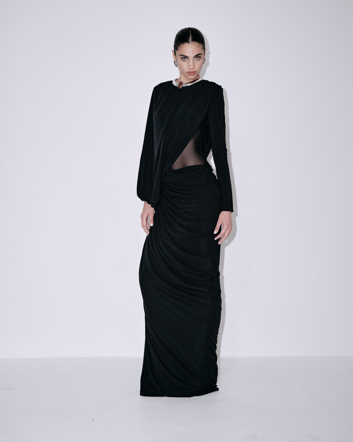 Black mesh draped evening dress with long sleeves and waist cutout