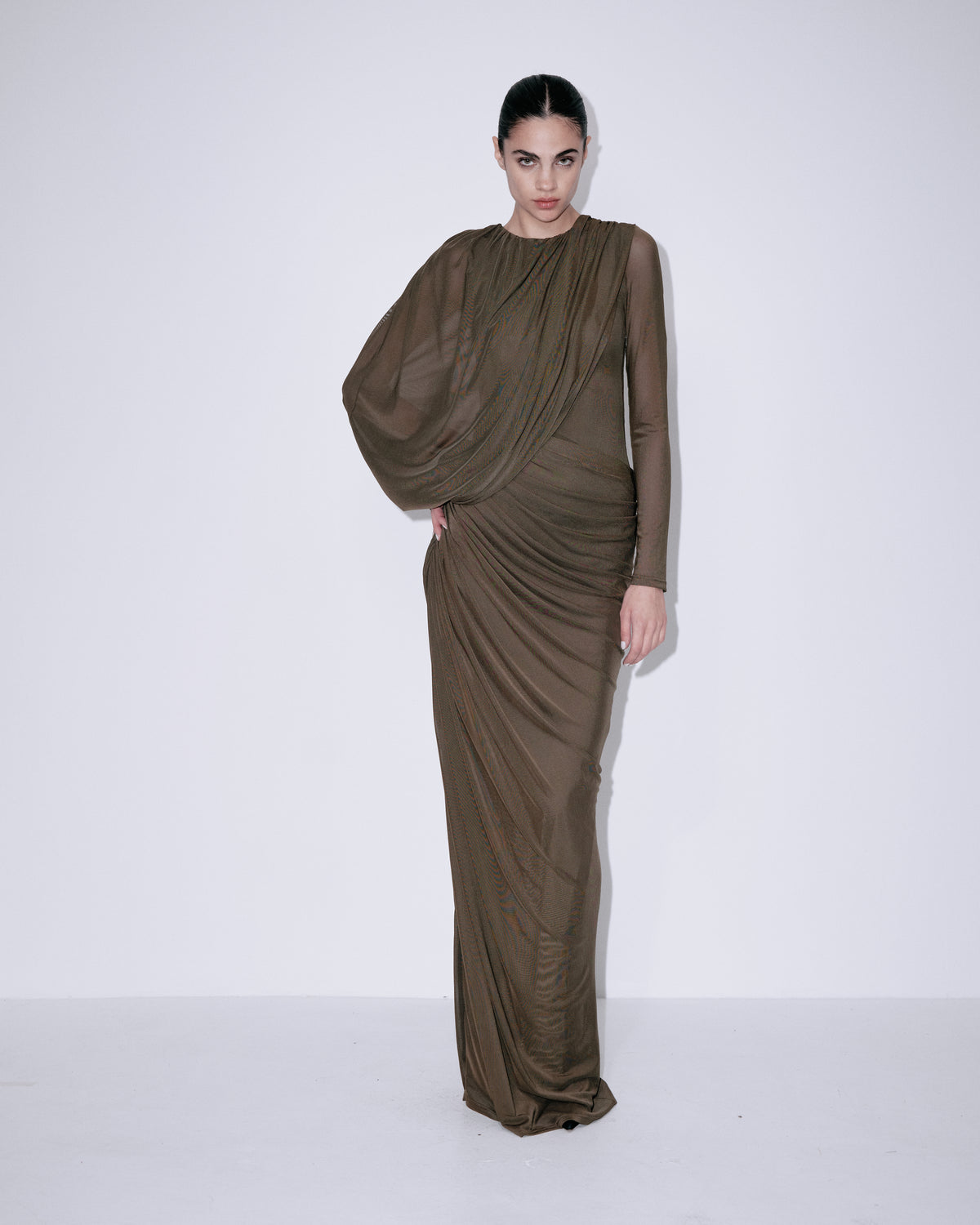 Forest green draped maxi dress with long puff sleeves and gathered side detail