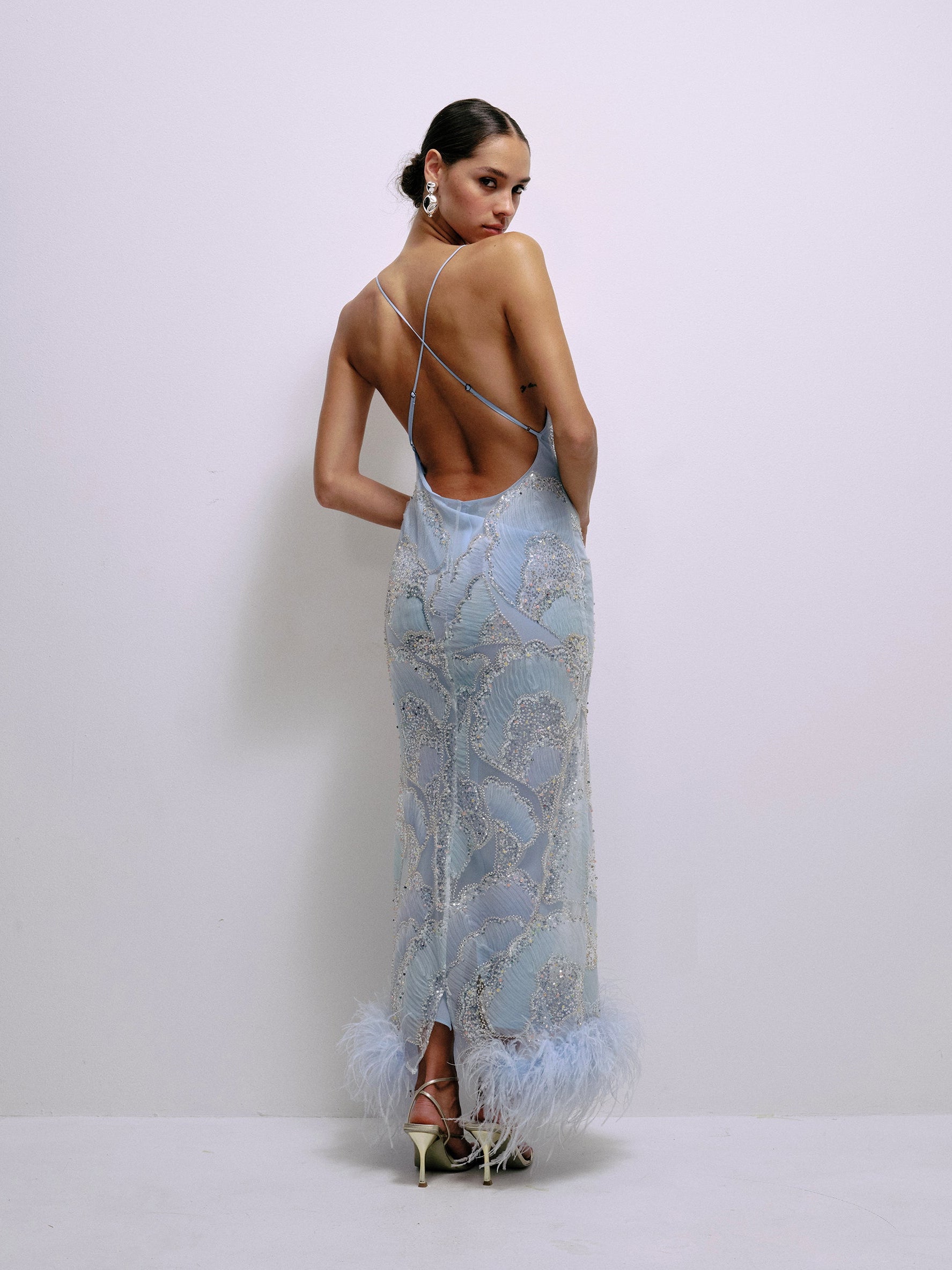 Baby blue sequin spaghetti-strap dress with open back and feather hem