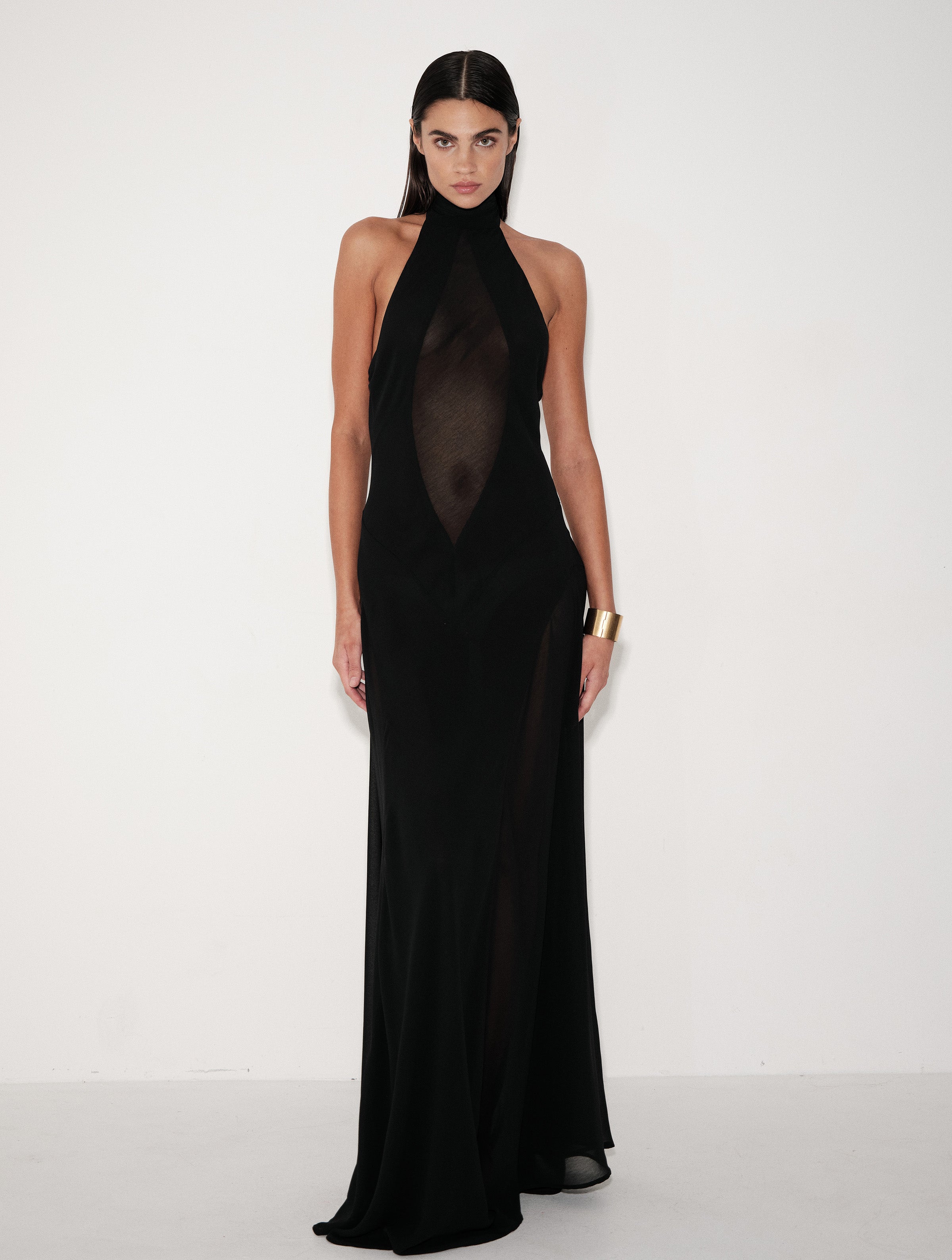 Black halter-neck maxi dress with sleeveless fitted bodice and long side slit