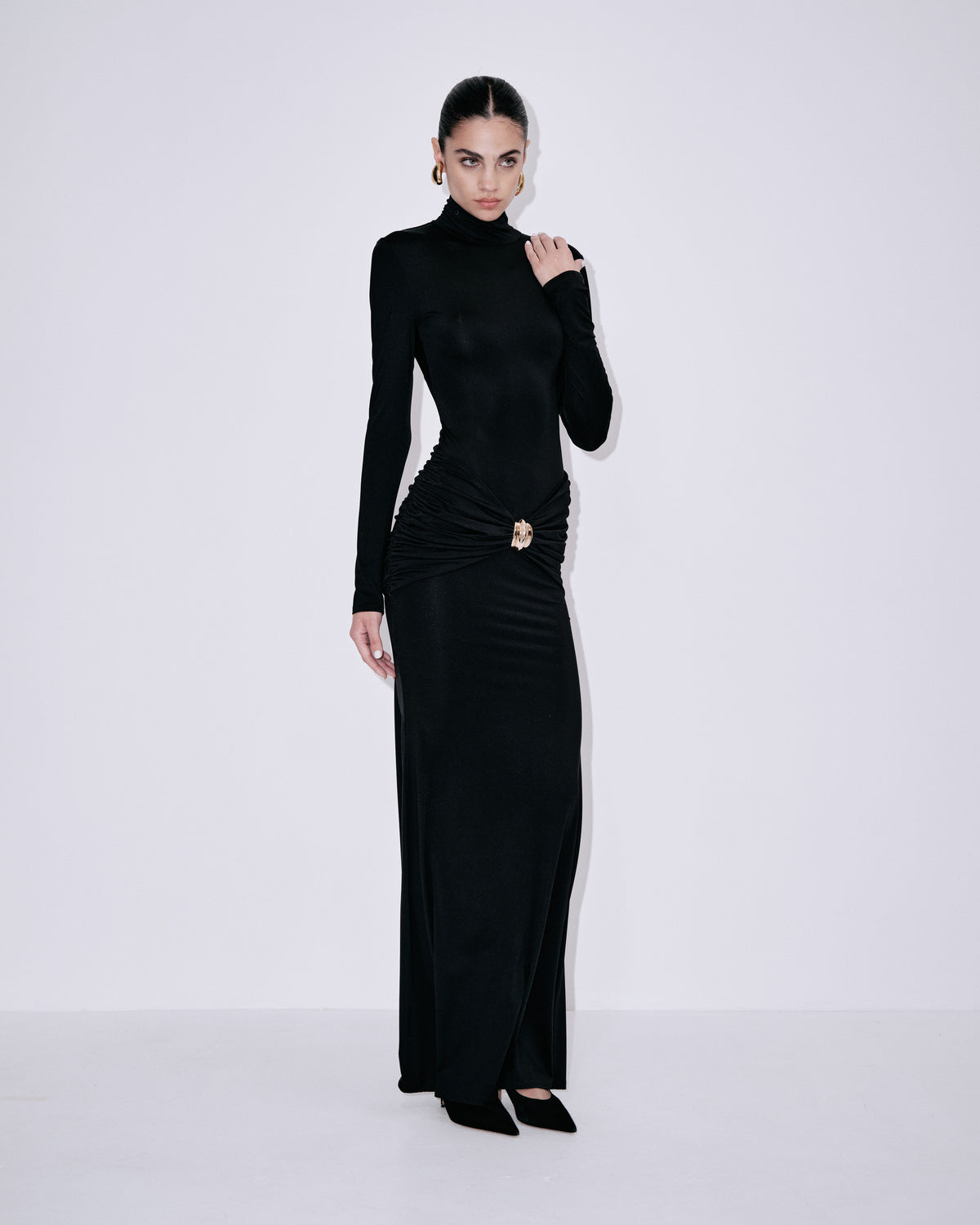 Black long-sleeve turtleneck maxi dress with ruched waist and front side slit