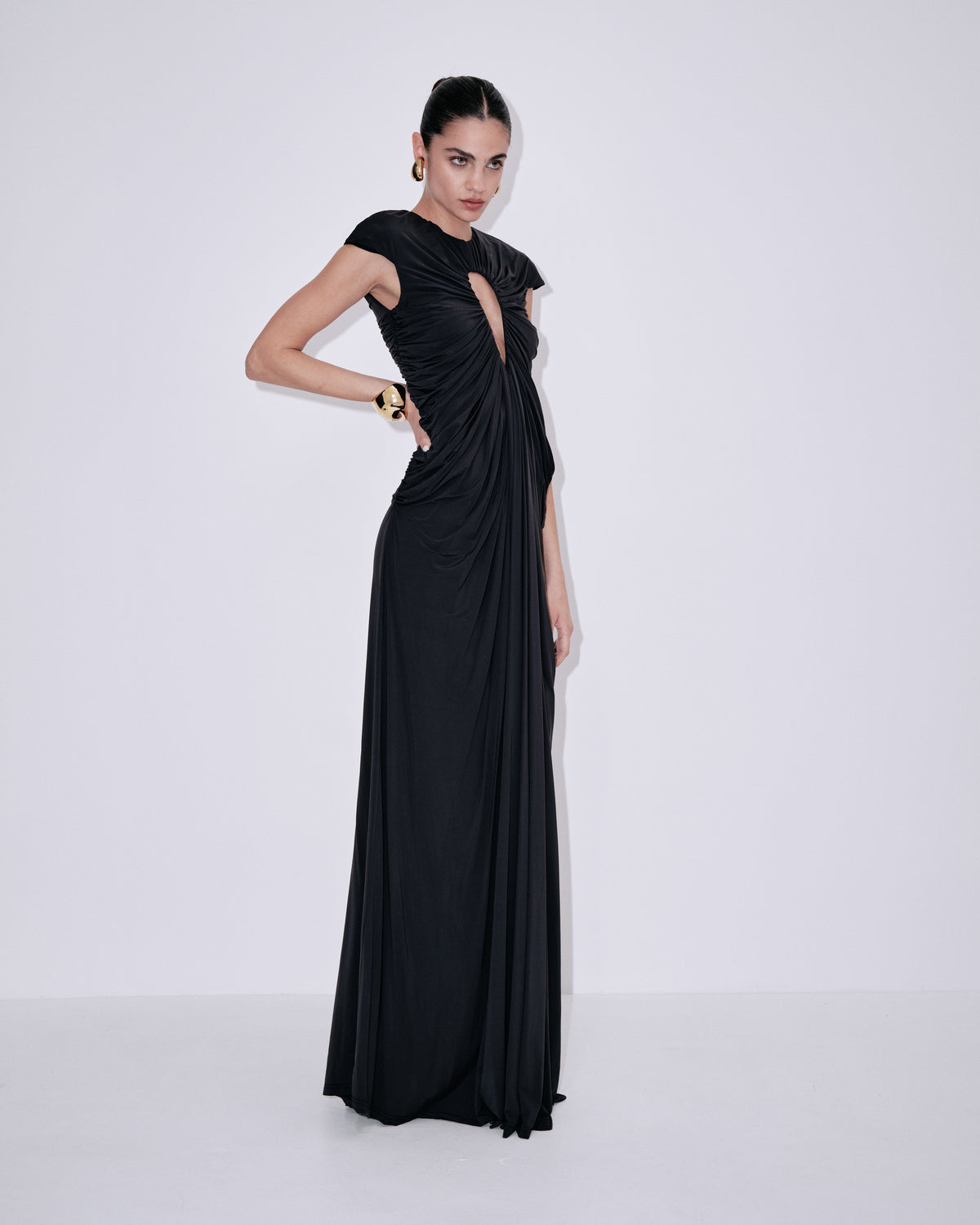 Black draped column maxi dress with keyhole neckline and side drape