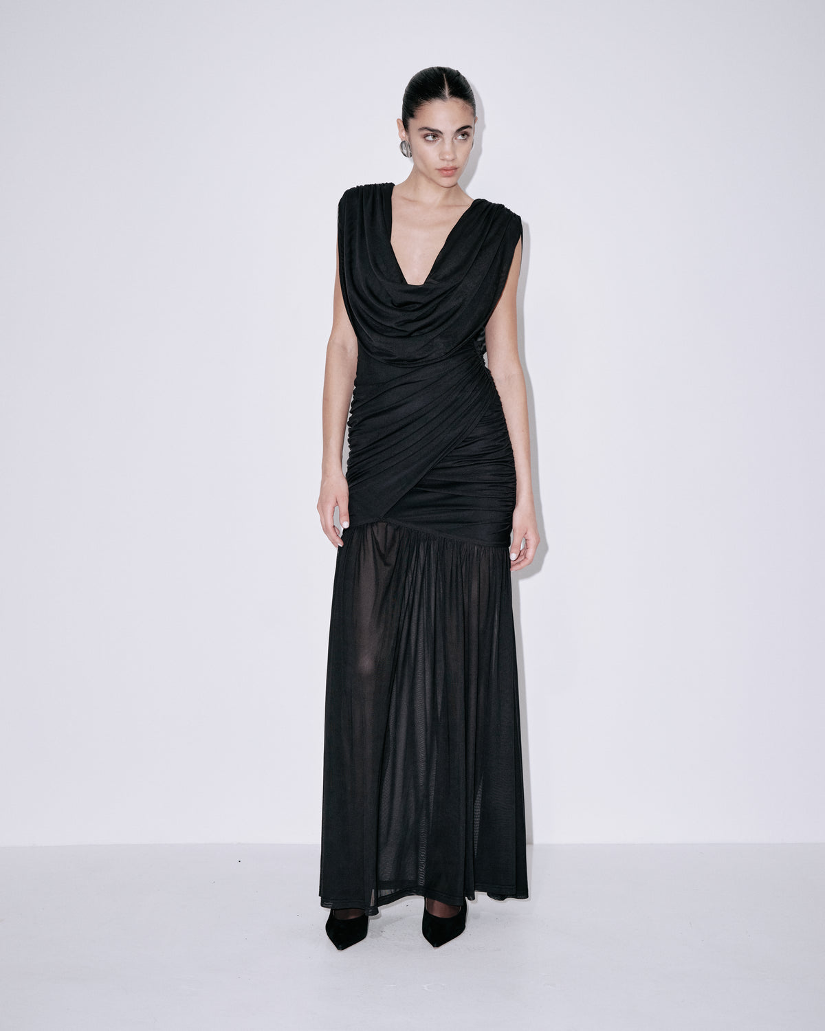 Black sleeveless cowl-neck dress with ruched bodice and long pleated skirt