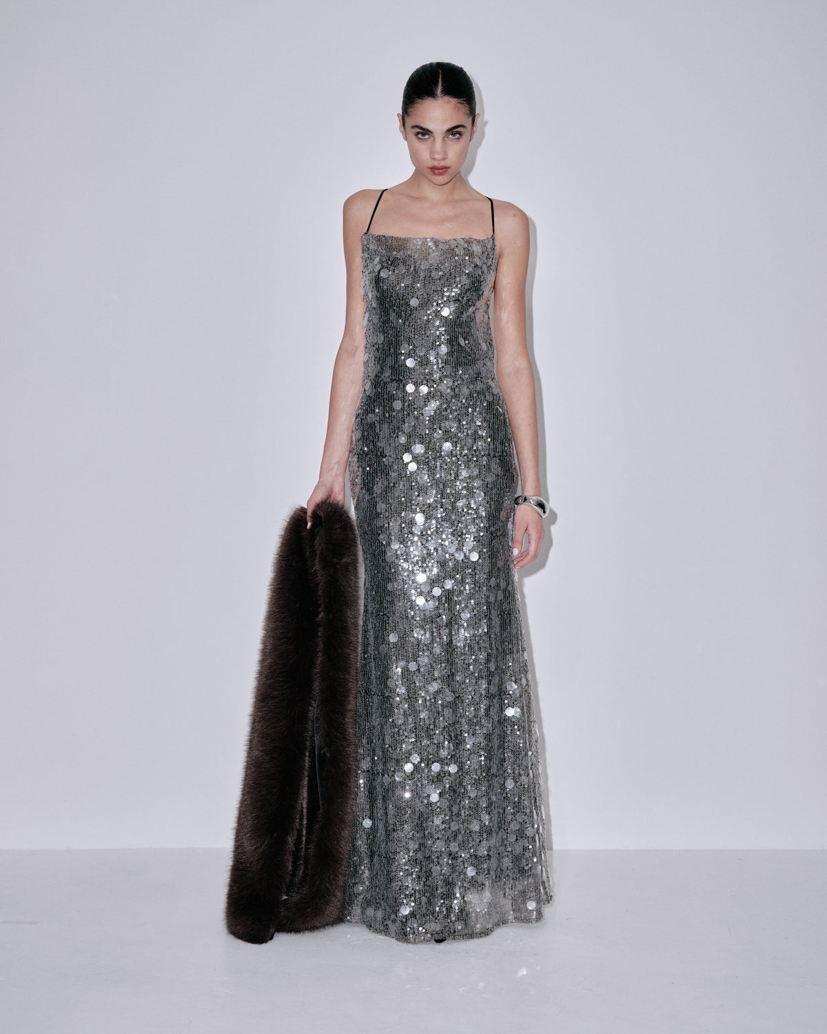 Silver sequin column maxi dress with thin spaghetti straps and square neckline