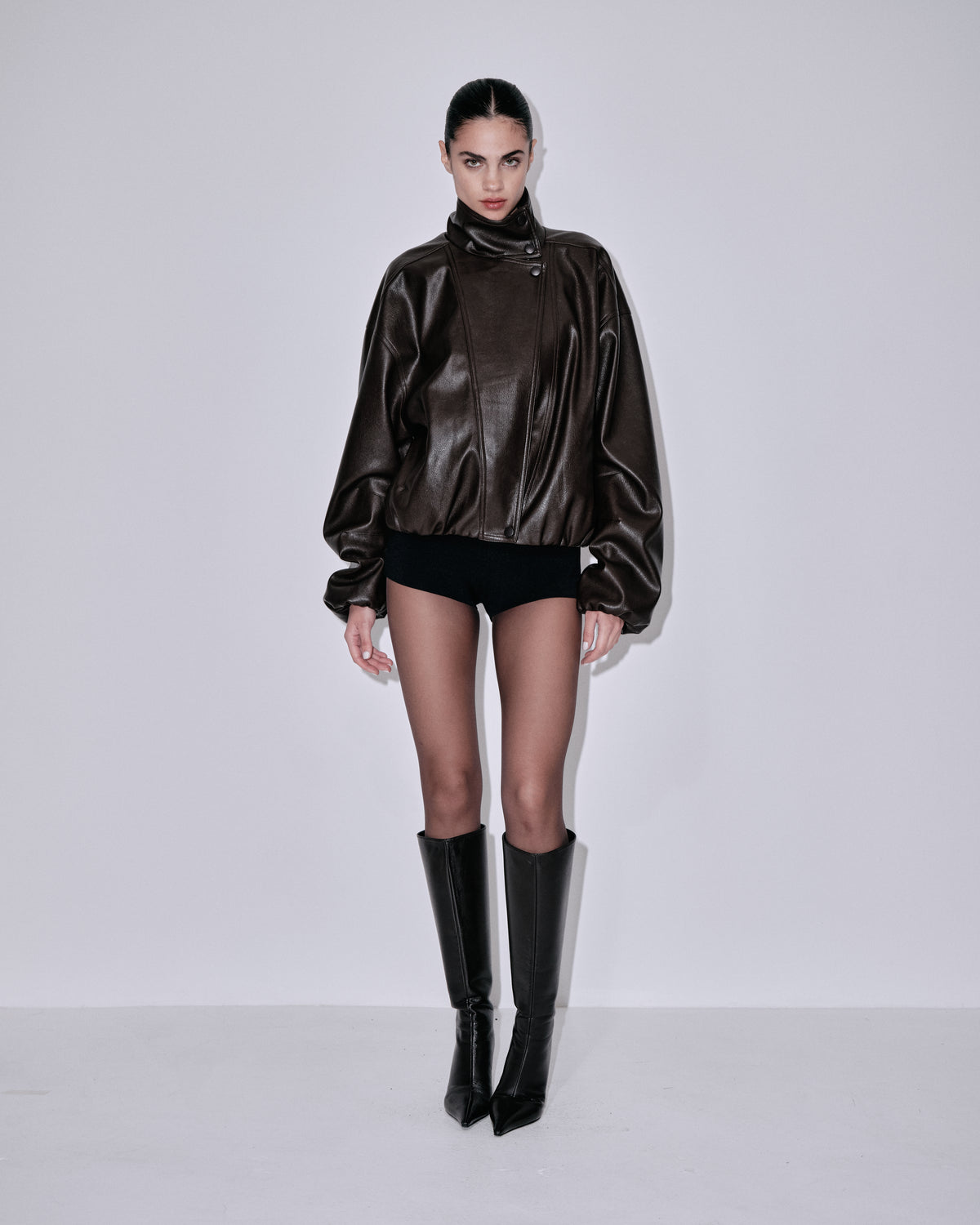 Chocolate bomber jacket with draped scarf collar and ribbed waistband