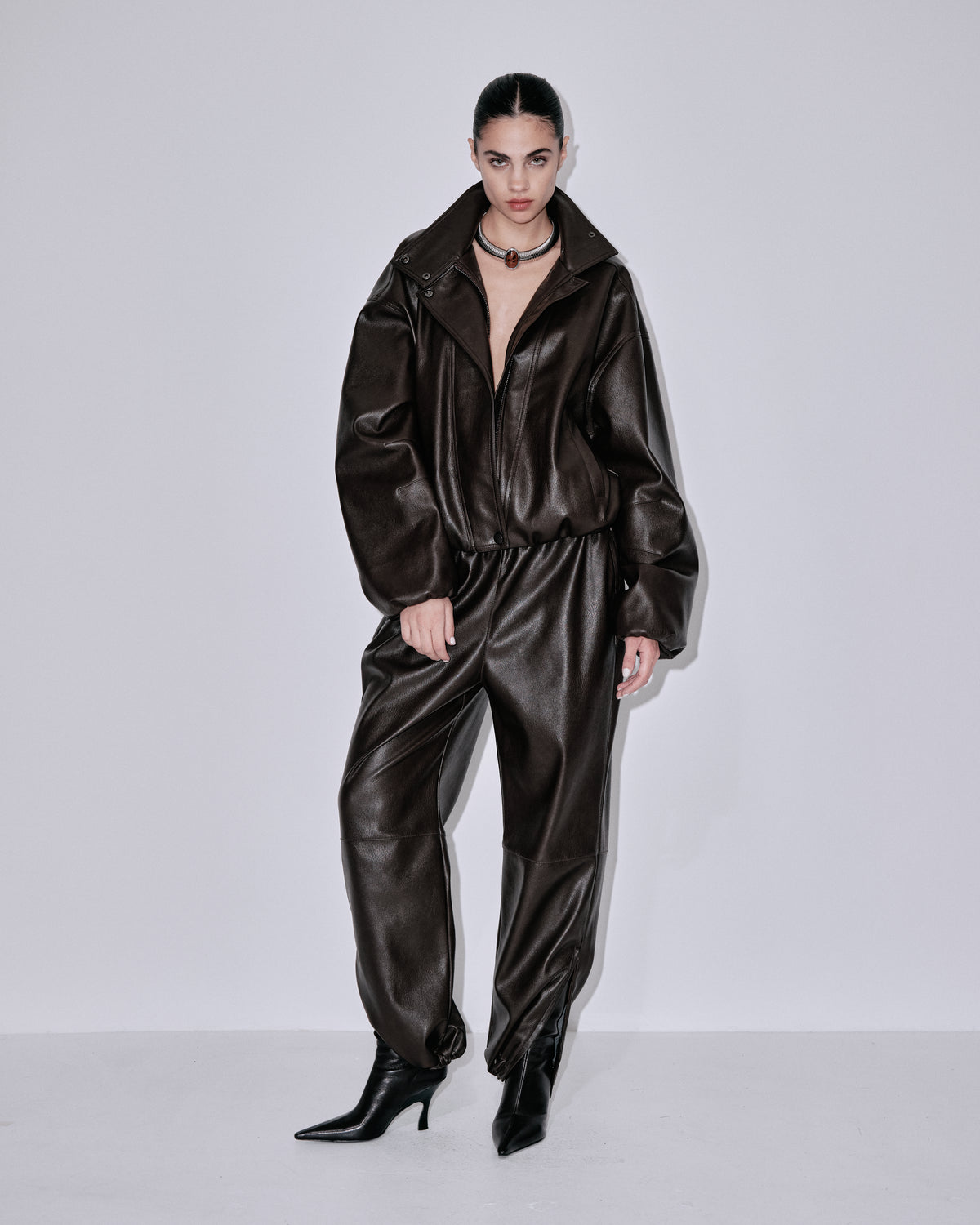Chocolate-brown shiny jogger pants, cuffed ankles and elastic waist