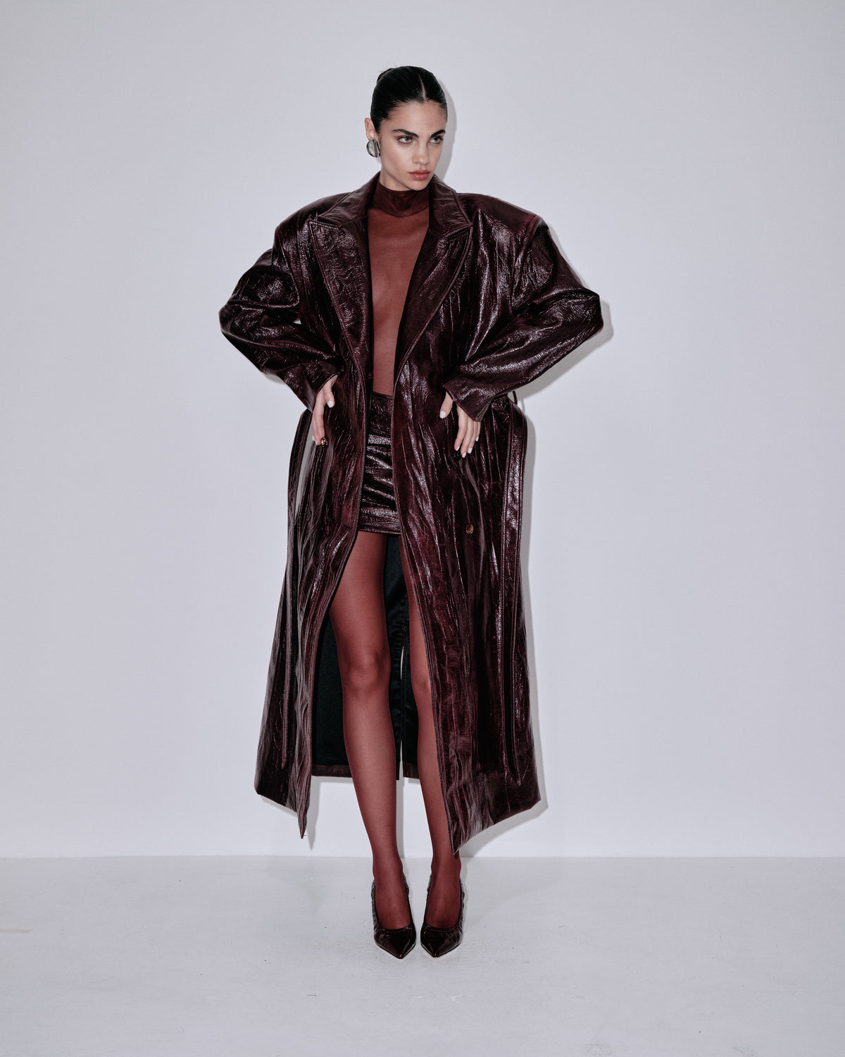 Dark metallic berry long belted coat with notched lapels and draped sleeves
