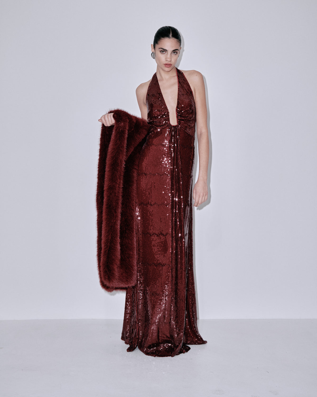 Wine sequin halter gown with faux-fur wrap at side