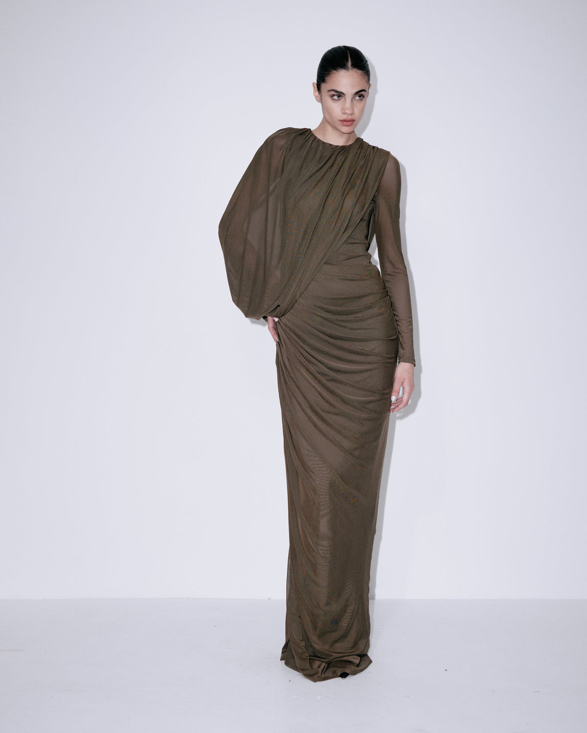 Forest green long-sleeve maxi dress with draped bodice and off-center ruched skirt