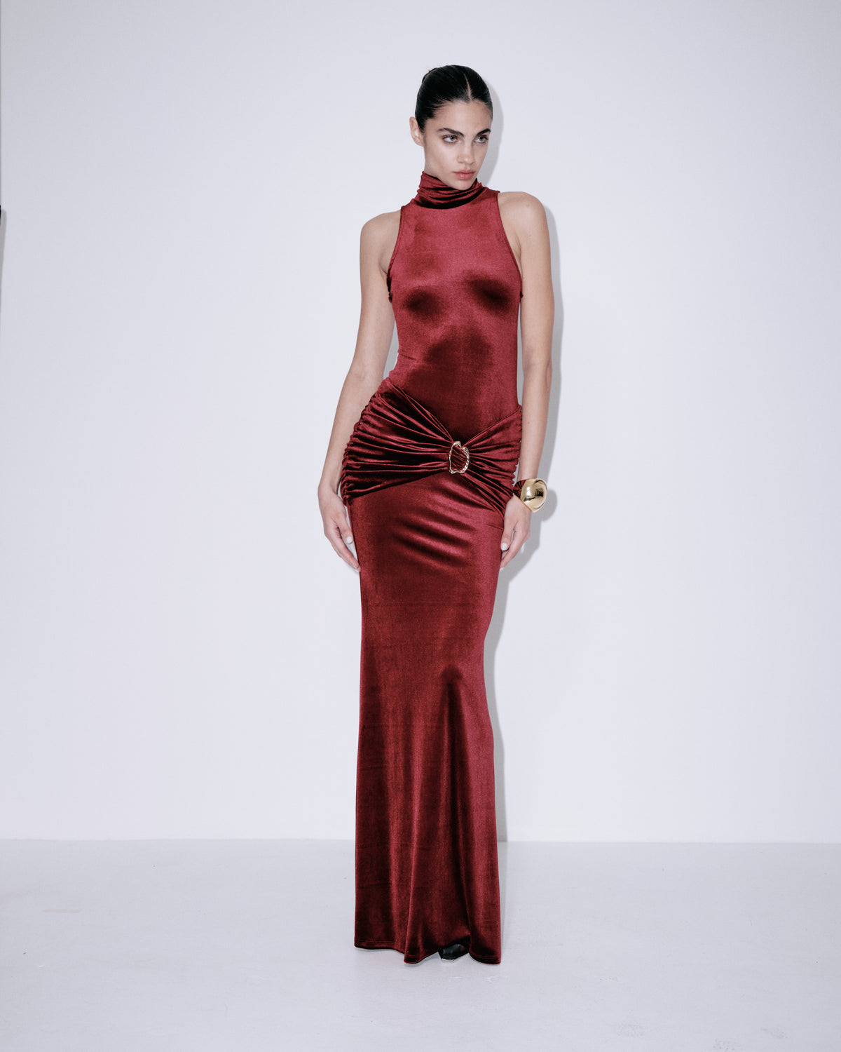 Wine red sleeveless halter maxi dress with high neckline and gathered ruched waist