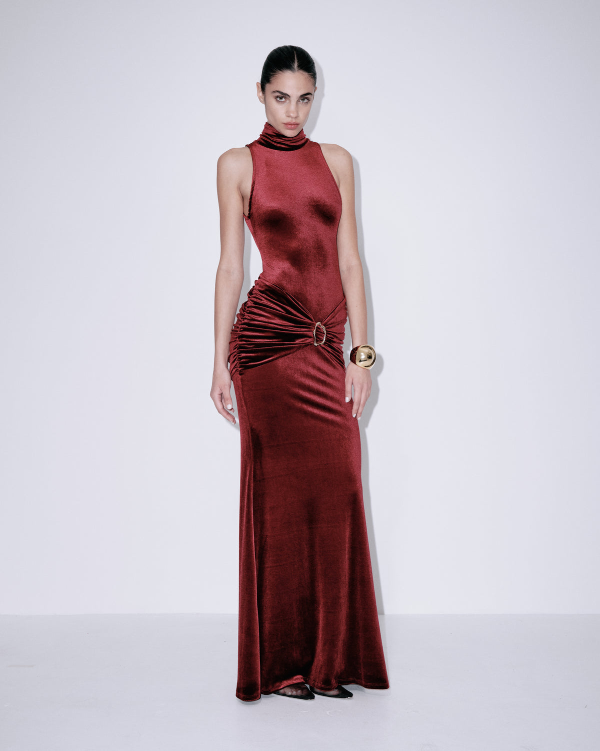 Wine red satin maxi dress with sleeveless halter neck, ruched waist detail, straight hem