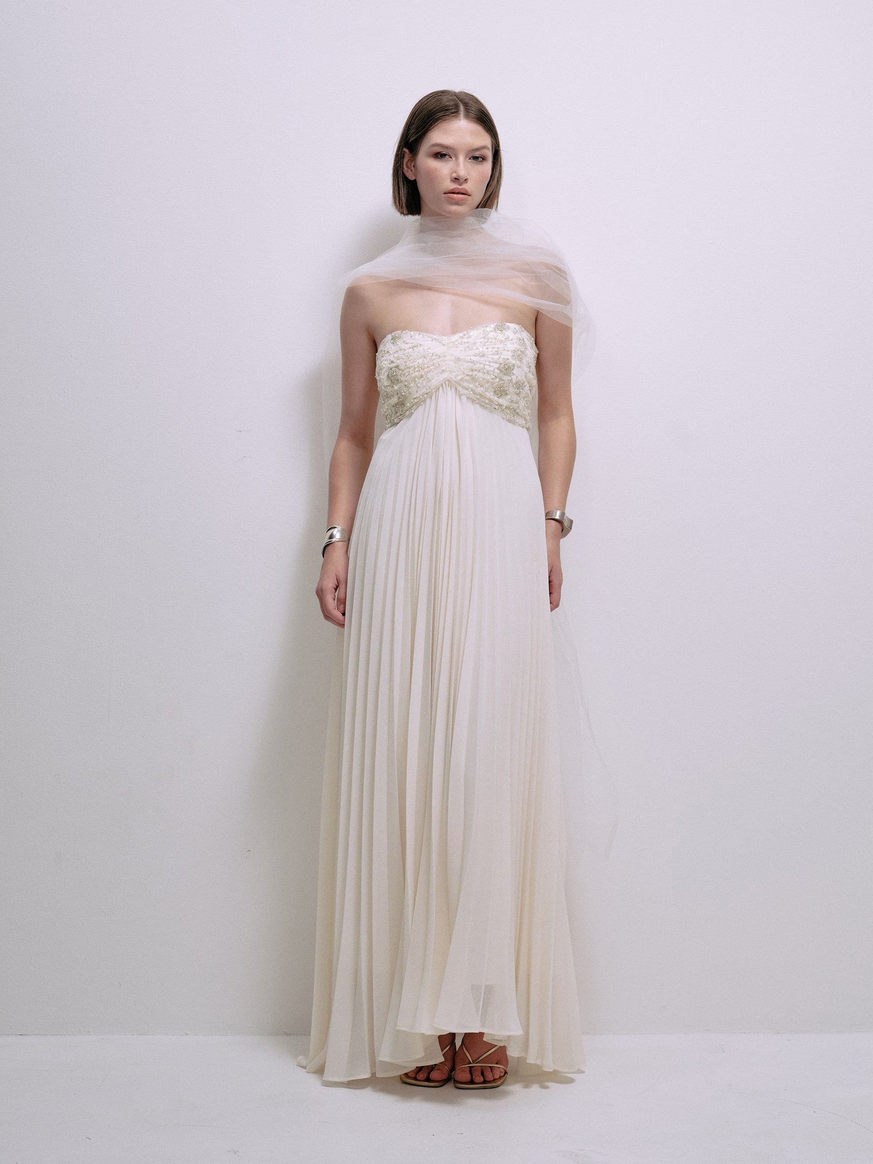 Cream strapless corset-style bodice maxi dress with pleated chiffon skirt