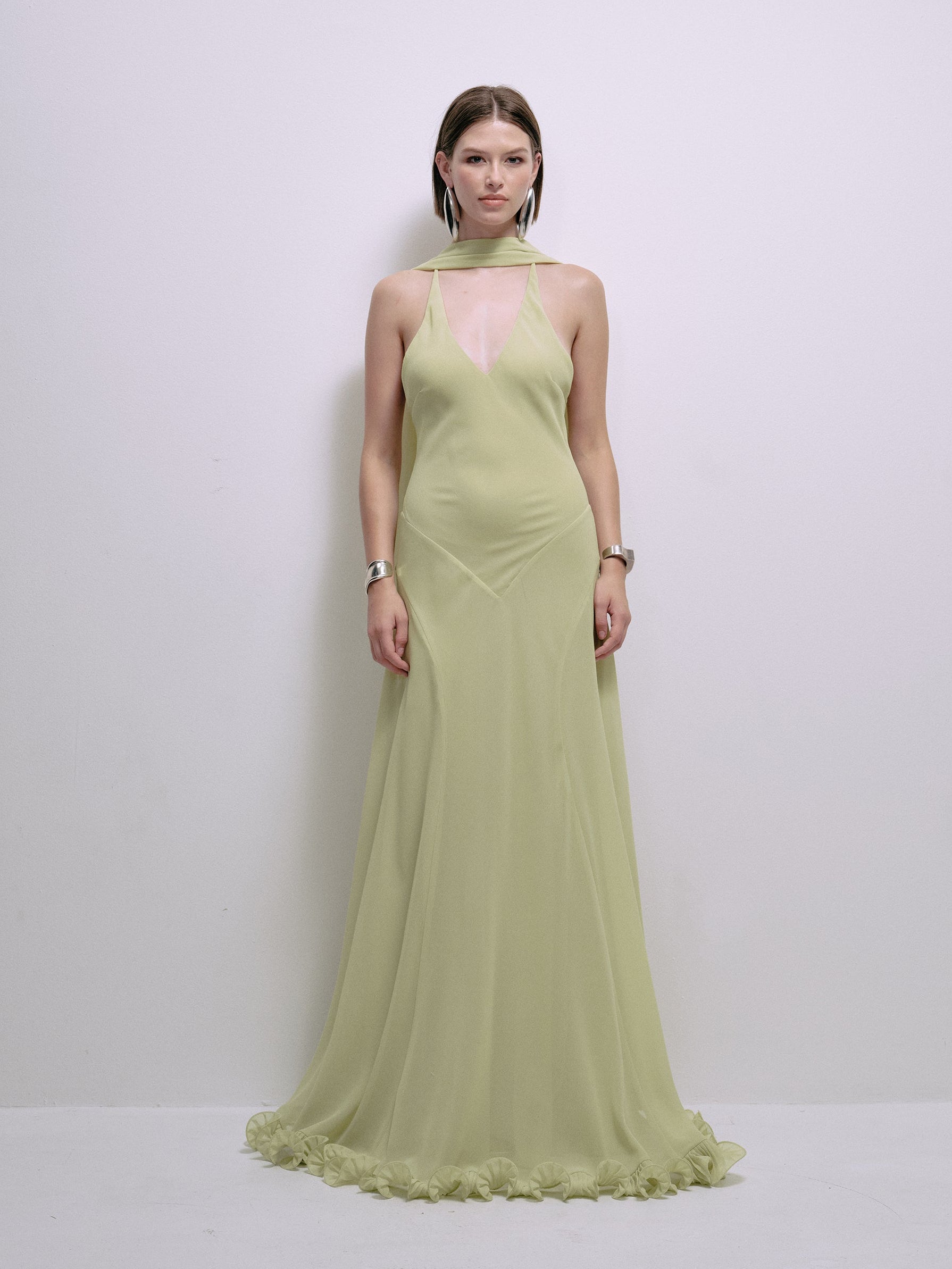 Lime halter maxi dress with sleeveless halter neckline and ruffled hem