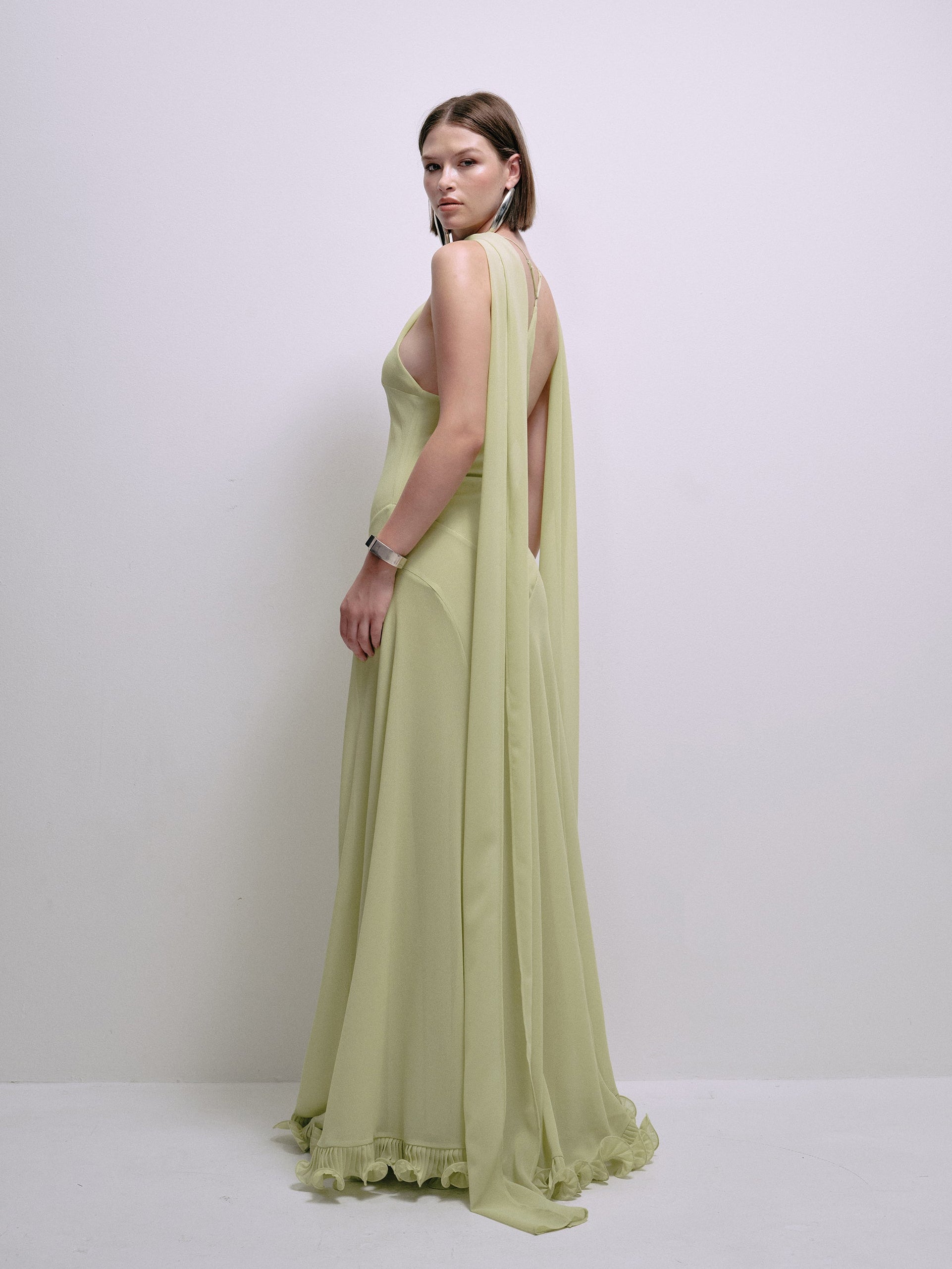 Lime halter maxi dress with draped straps on the back and ruffled hem