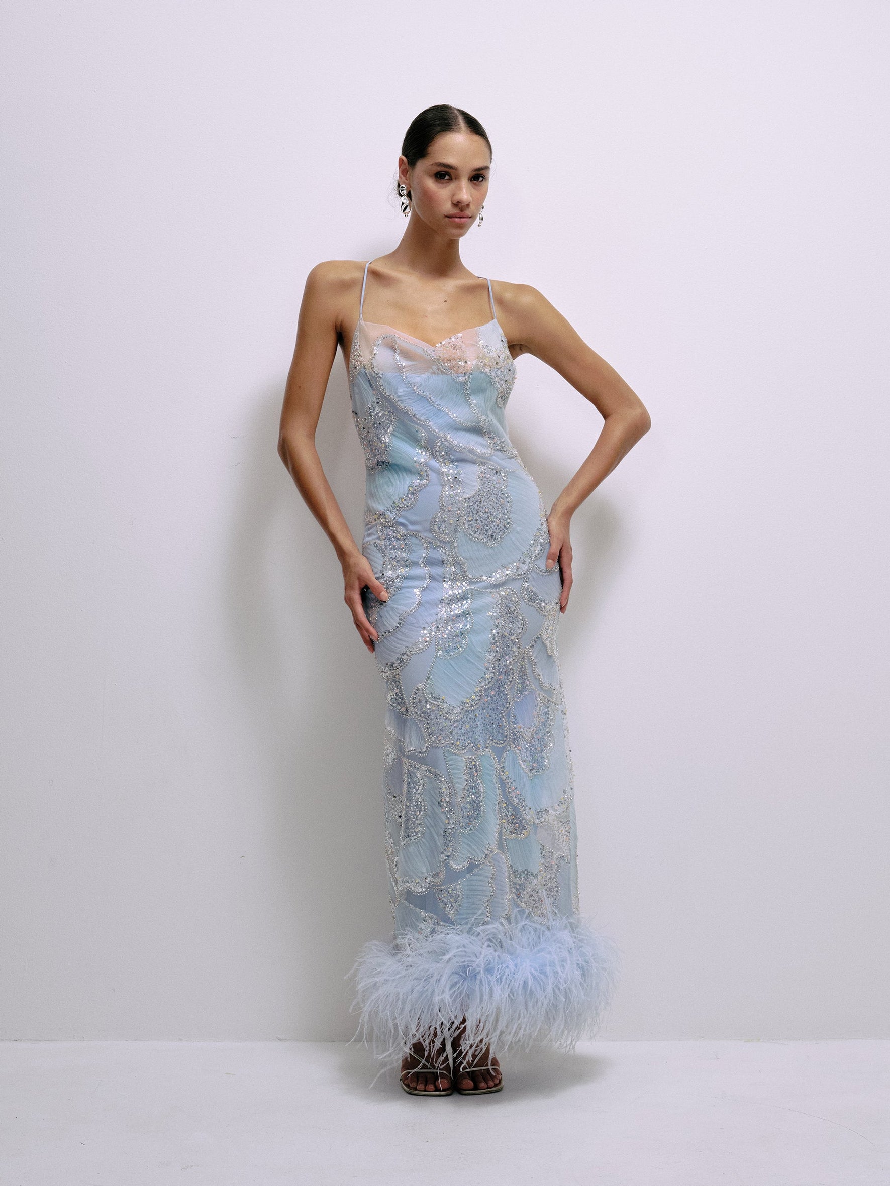 Baby blue sequin spaghetti-strap midi dress with feather trim at hem