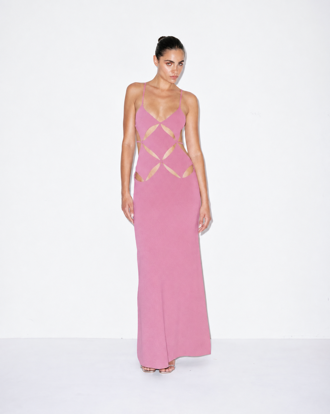 Pink V-neck maxi slip dress with geometric cutout detail at bodice