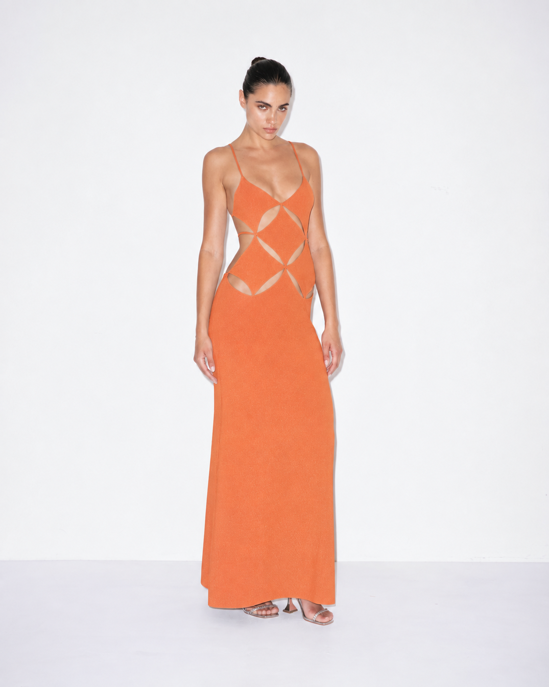 Orange sleeveless maxi dress with spaghetti straps and geometric cutout front
