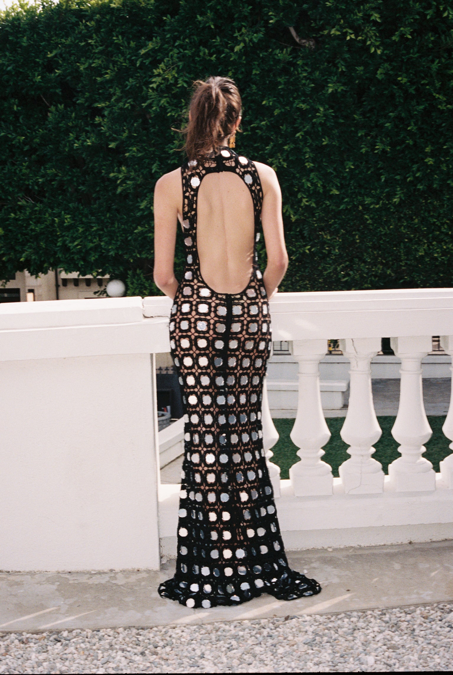 Sleeveless open-back halter maxi dress in black with white circle pattern
